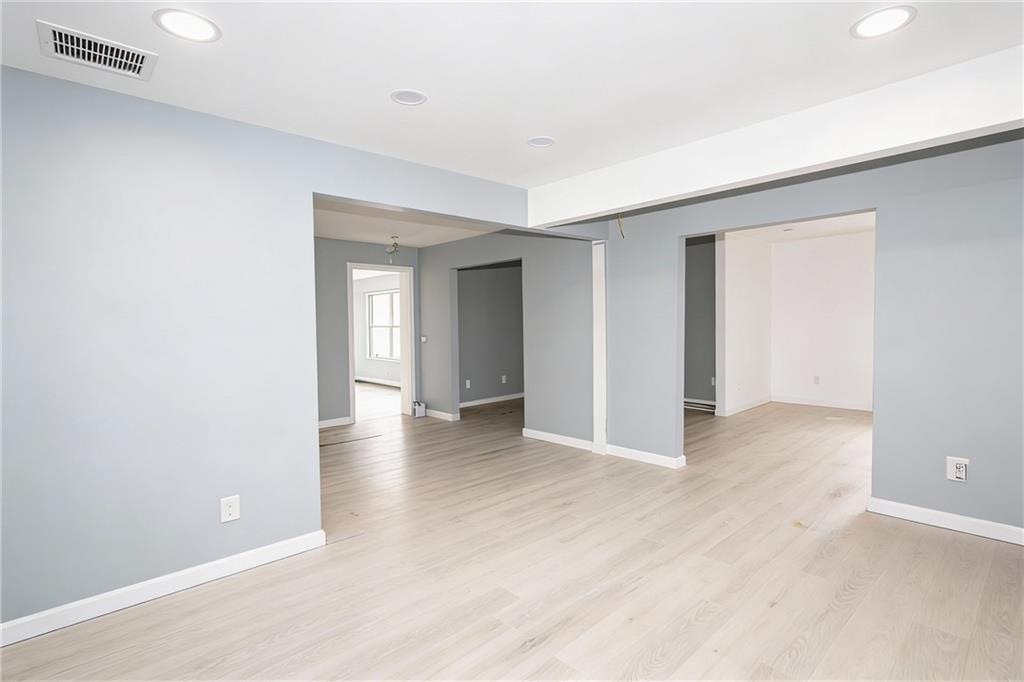 706 Collins Hill Road Lawrenceville, GA 30046 - Photo 14 of 33 a view of an empty room with wooden floor and closet