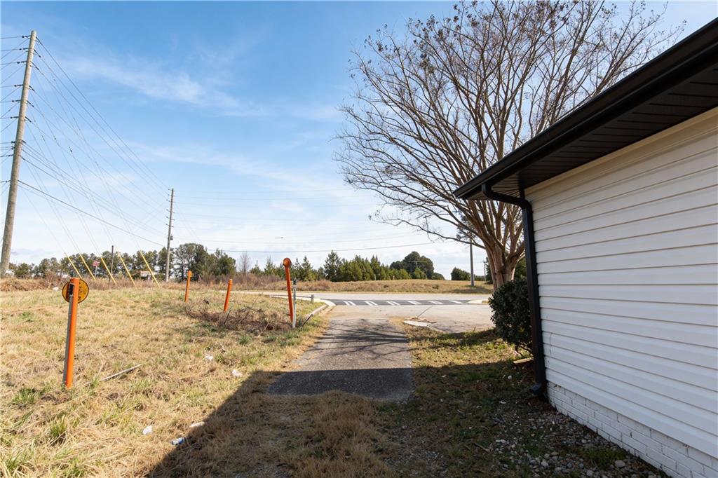 706 Collins Hill Road Lawrenceville, GA 30046 - Photo 23 of 33 a view of a yard with trees in the background