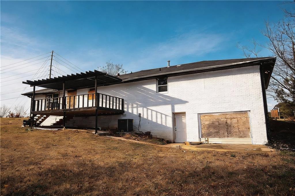 706 Collins Hill Road Lawrenceville, GA 30046 - Photo 24 of 33 a view of a house with a yard