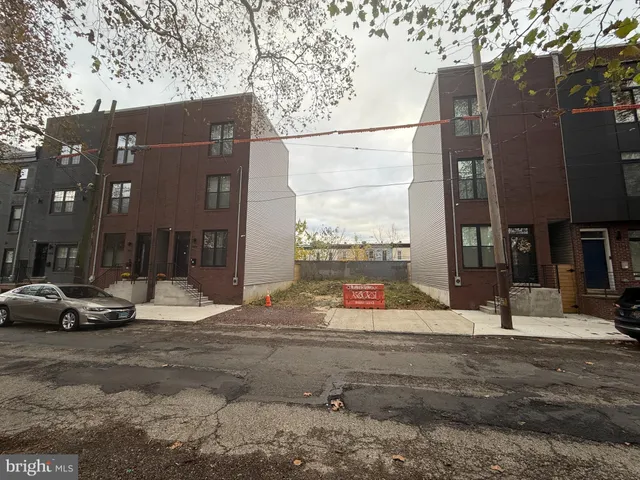 a view of street with parked cars