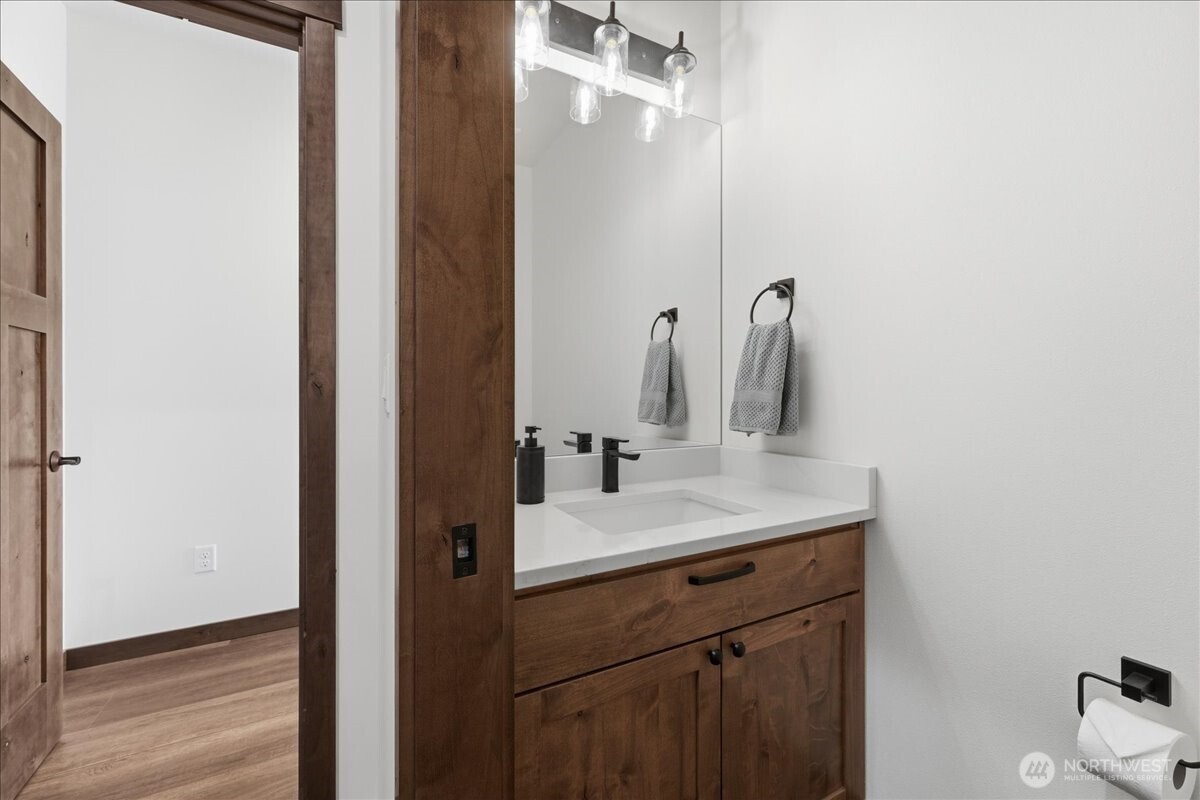 110 Slide View Lane Manson, WA 98831 - Photo 22 of 38 a bathroom with a sink and a mirror