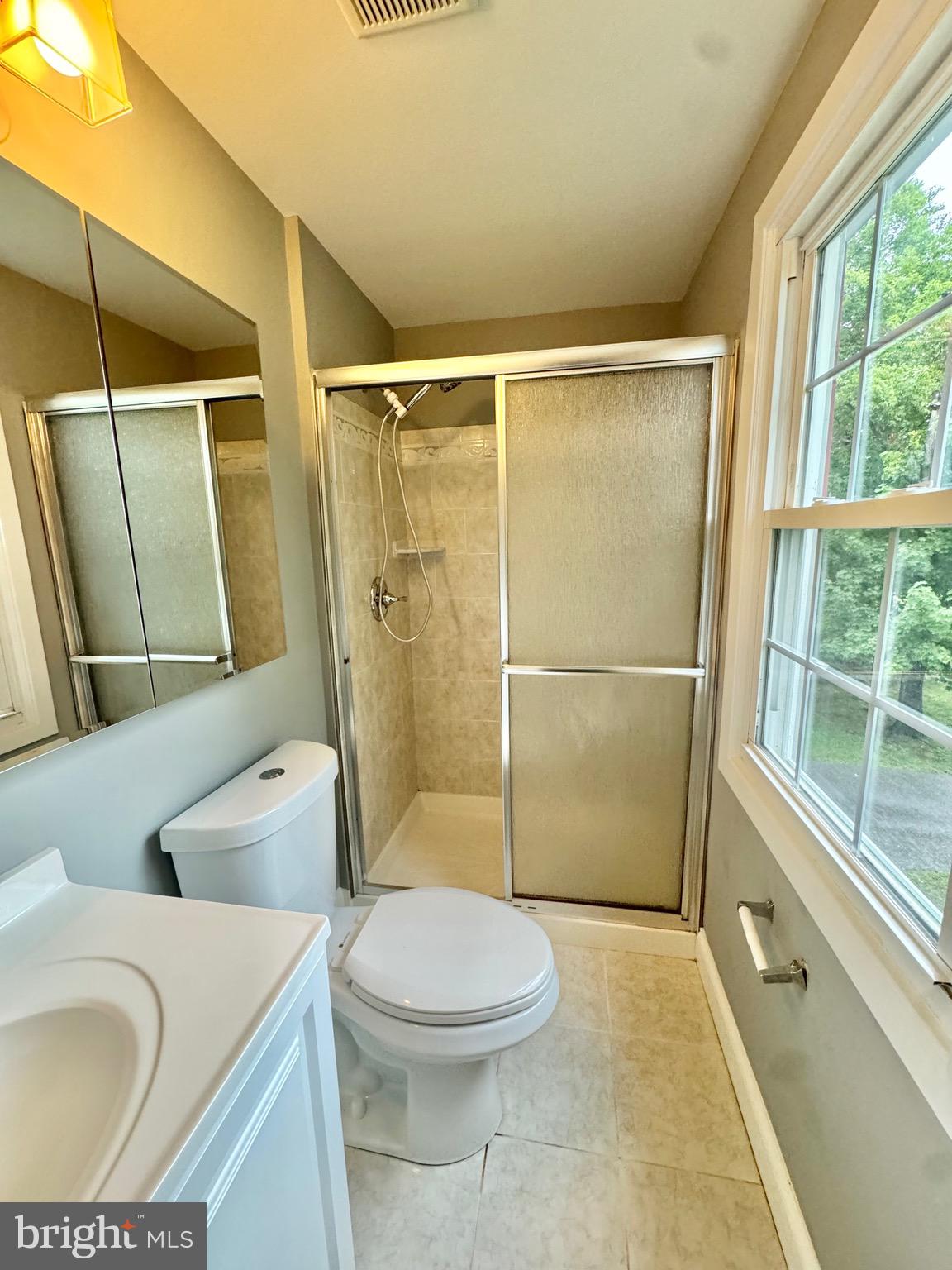 4908 Rocky Spring Lane Bowie, MD 20715 - Photo 23 of 36 a bathroom with a sink toilet and shower