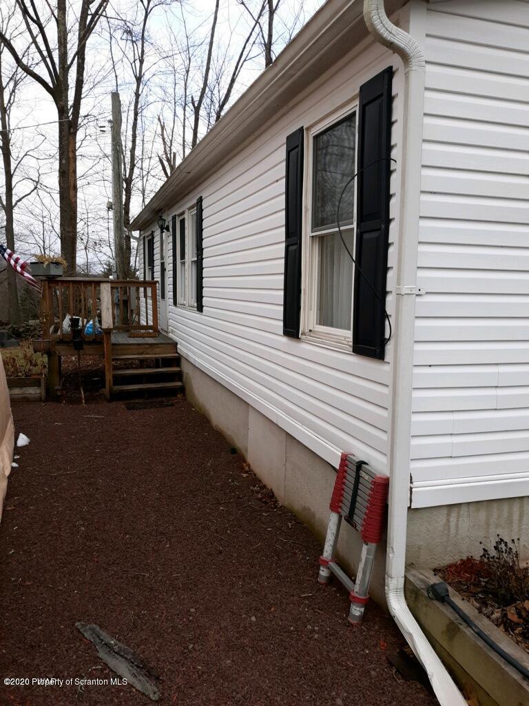 283 Bortree Road Moscow, PA 18444 - Photo 2 of 19 a view of a two chairs in the back yard