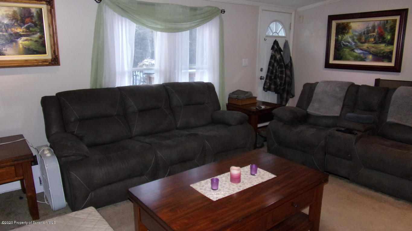 283 Bortree Road Moscow, PA 18444 - Photo 4 of 19 a living room with furniture and a couch