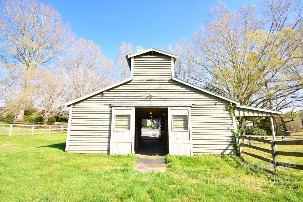 131 Block House Road Tryon, NC 28782 - Photo 31 of 47 a view of a house with a yard