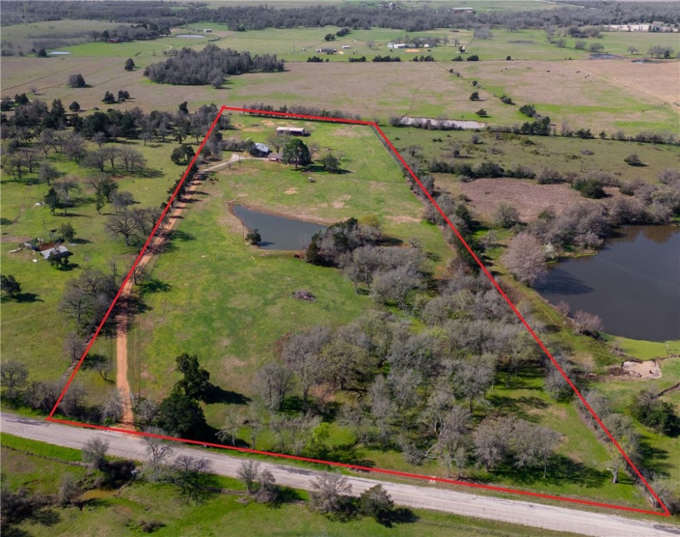 9269 Wheelock Hall Road Hearne, TX 77859 - Photo 1 of 25 an aerial view of house with yard swimming pool and outdoor seating