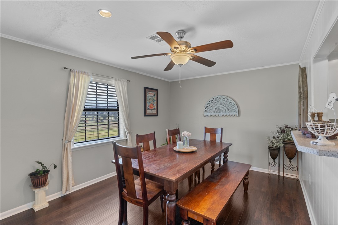 9269 Wheelock Hall Road Hearne, TX 77859 - Photo 12 of 25 a view of a dining room with furniture window and wooden floor