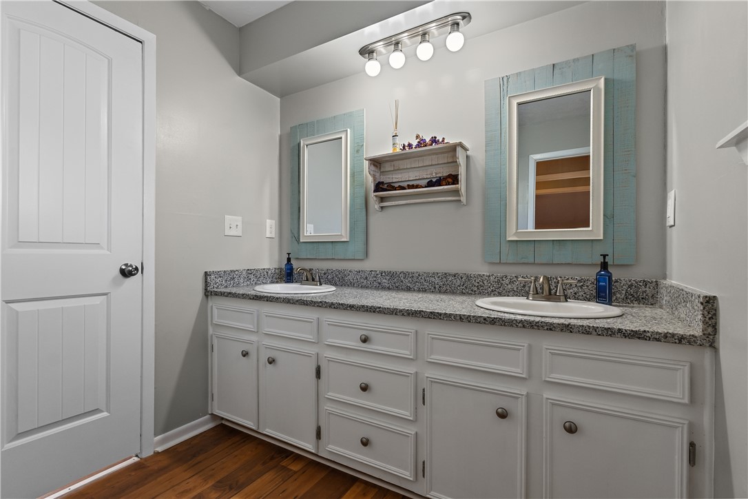 9269 Wheelock Hall Road Hearne, TX 77859 - Photo 19 of 25 a bathroom with a granite countertop sink mirror and window