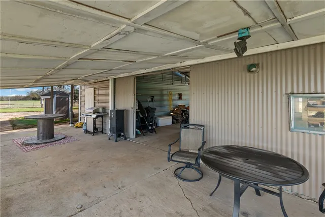 an aerial view of a house with outdoor space