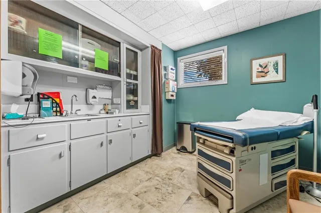 a kitchen with a stove and cabinets