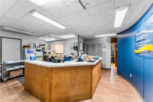 a view of living room with furniture and a chandelier
