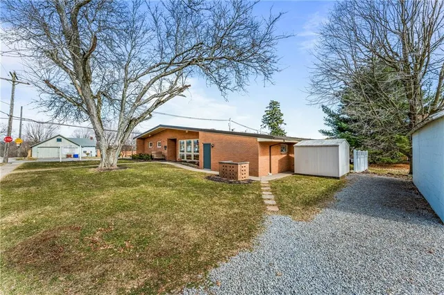 a view of a house with a yard