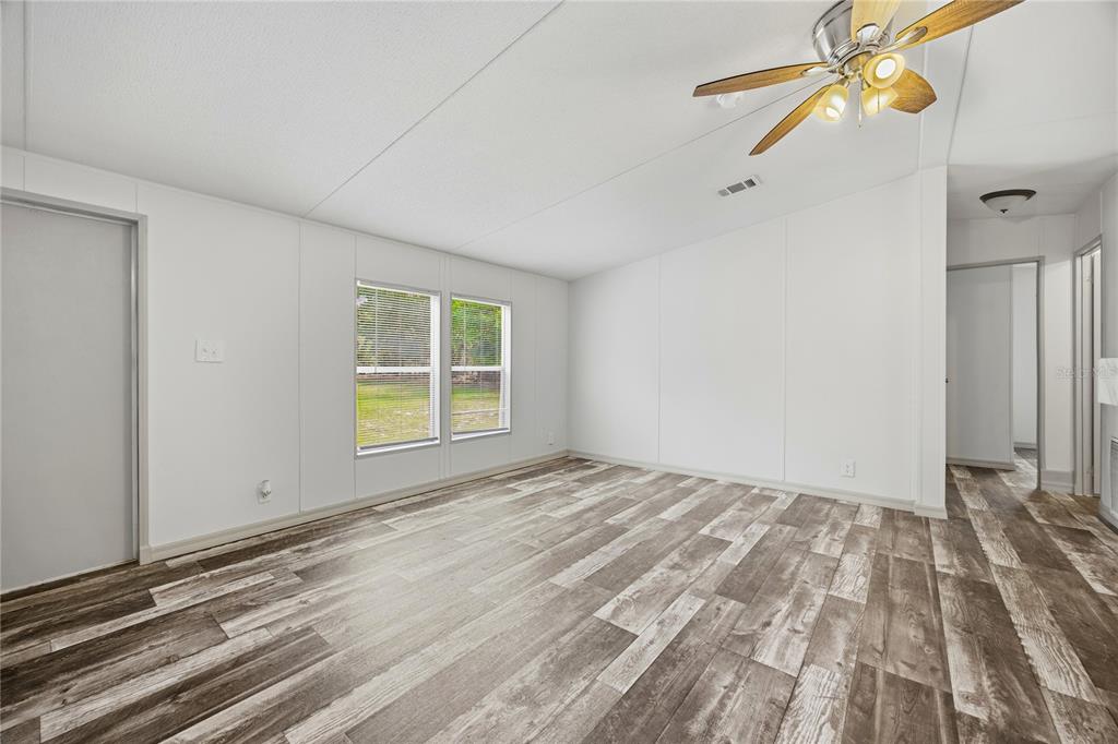 4950 80 Street Chiefland, FL 32626 - Photo 11 of 68 a view of empty room with window and ceiling fan