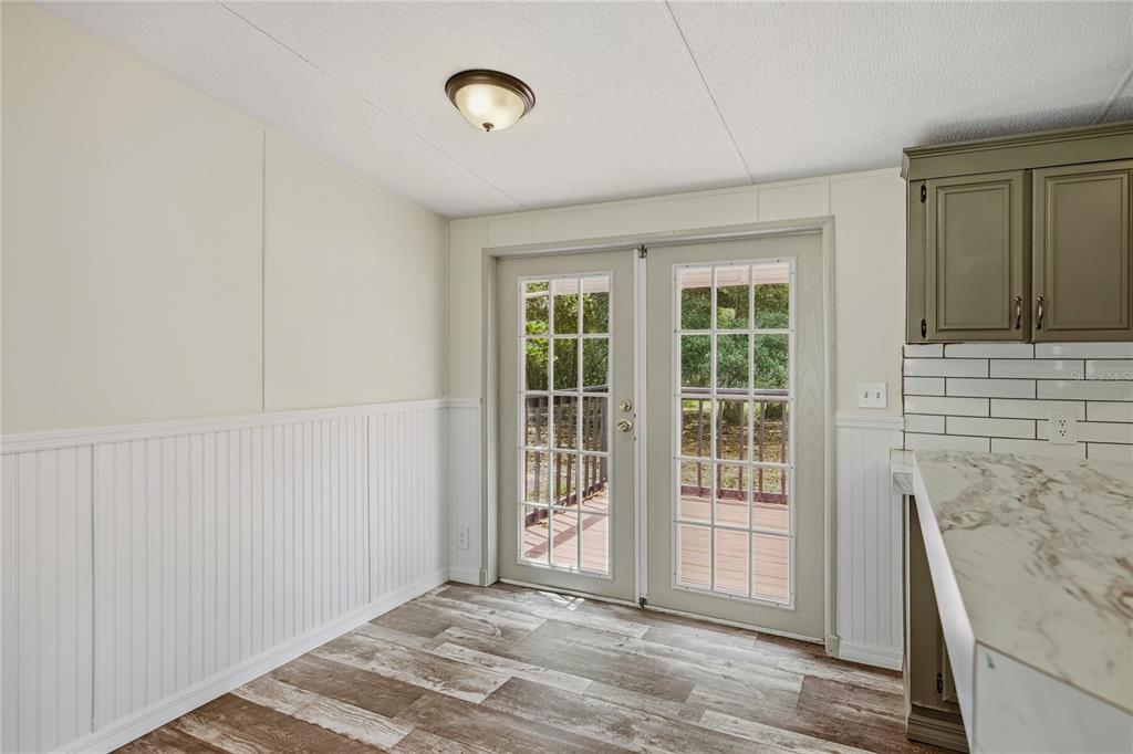 4950 80 Street Chiefland, FL 32626 - Photo 16 of 68 a view of a livingroom with wooden floor and a window