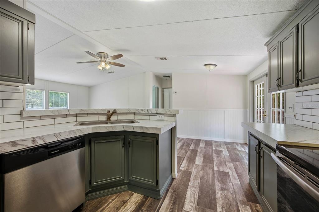4950 80 Street Chiefland, FL 32626 - Photo 20 of 68 a kitchen with a sink appliances and cabinets