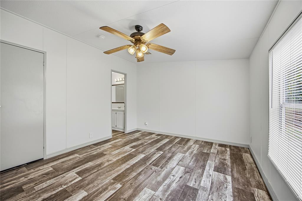 4950 80 Street Chiefland, FL 32626 - Photo 30 of 68 a view of empty room with wooden floor and fan