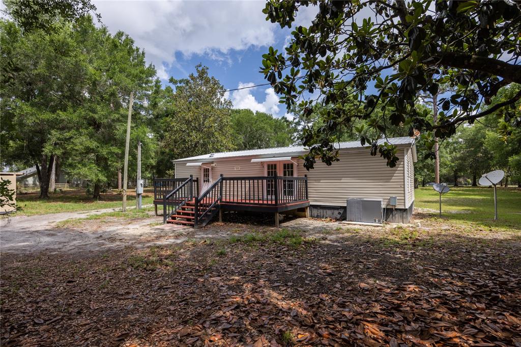 4950 80 Street Chiefland, FL 32626 - Photo 36 of 68 a view of a house with a yard