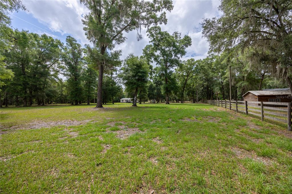 4950 80 Street Chiefland, FL 32626 - Photo 49 of 68 a view of outdoor space with deck and yard