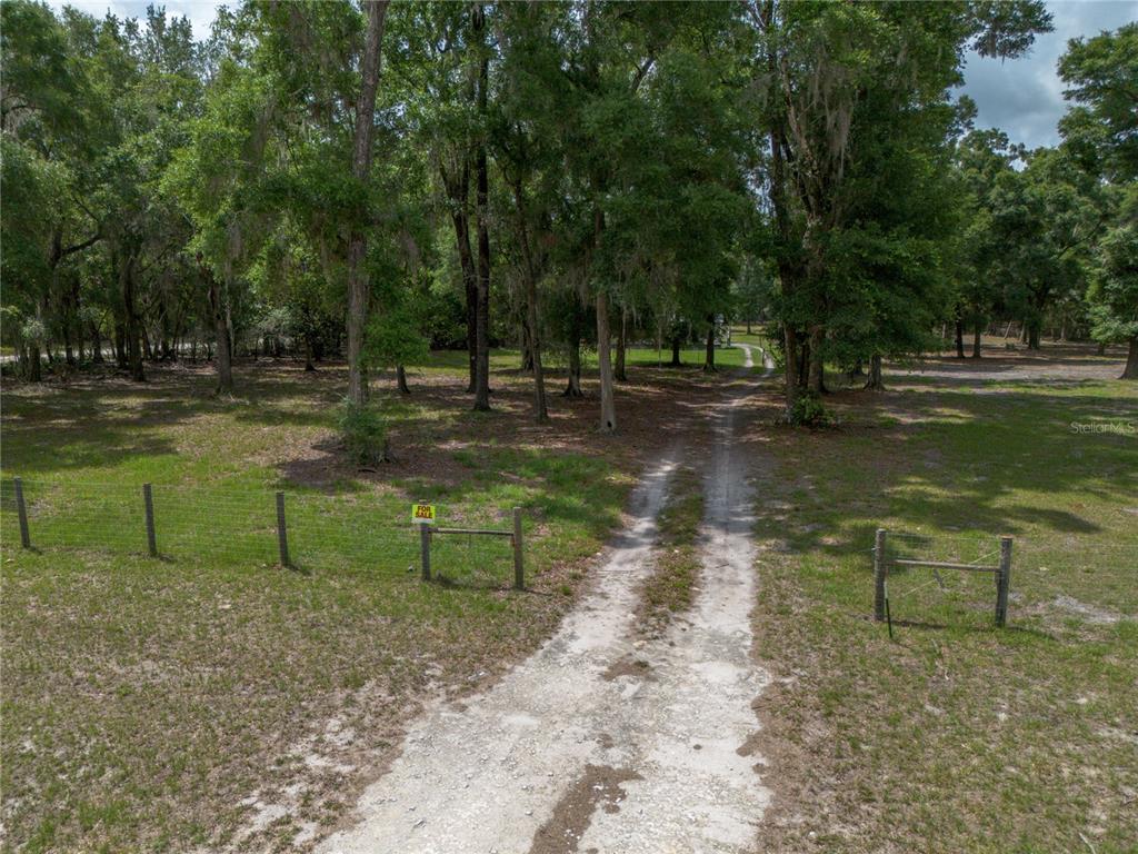 4950 80 Street Chiefland, FL 32626 - Photo 51 of 68 a view of a park with large trees
