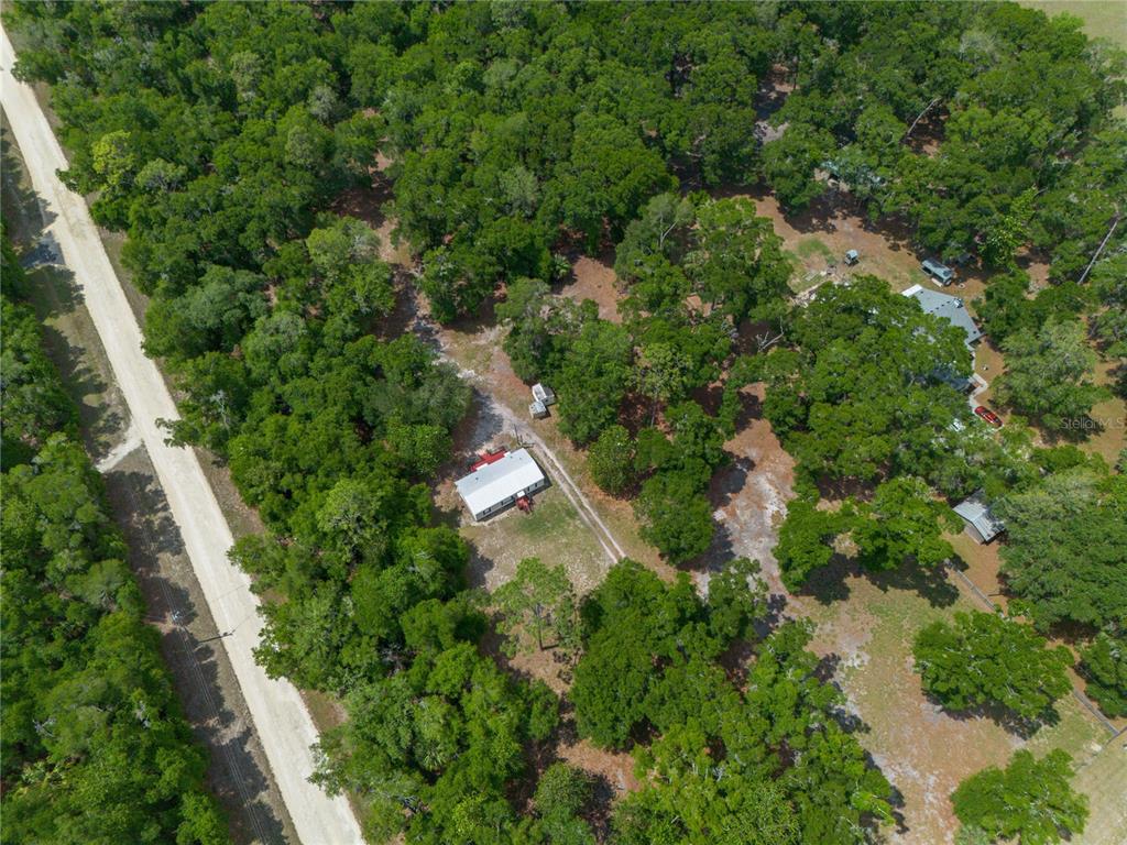 4950 80 Street Chiefland, FL 32626 - Photo 56 of 68 an aerial view of residential house with outdoor space and trees all around