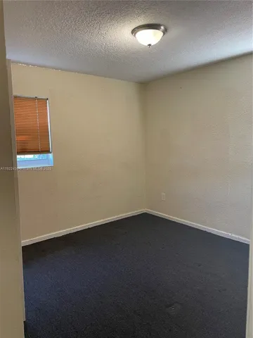 an empty room with a workbench