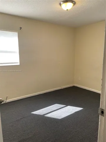 a bathroom with a toilet and a bathtub