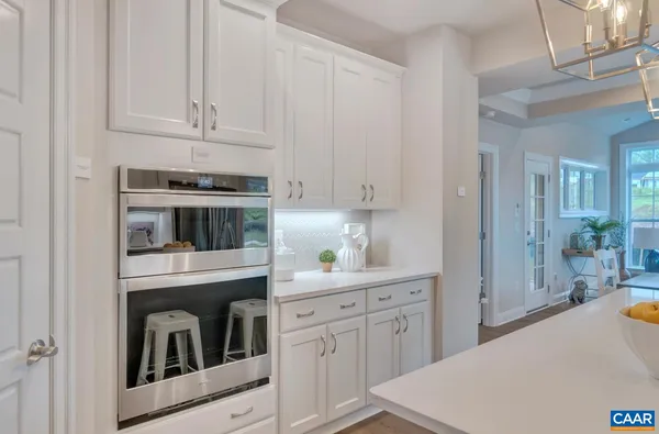 a kitchen with cabinets and appliances