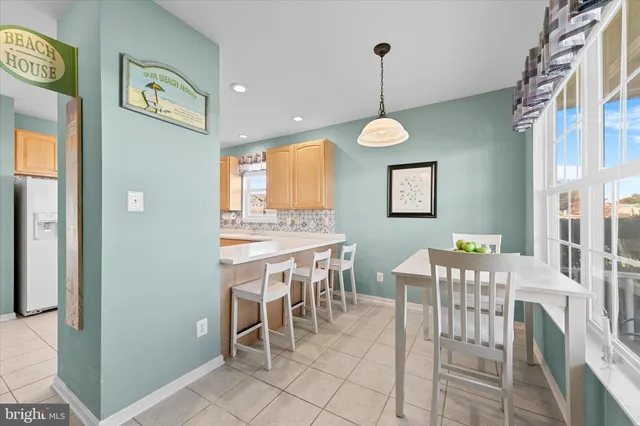 a living room with furniture a window and a fireplace