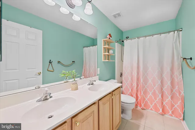 a view of a room with gym equipment and a large window