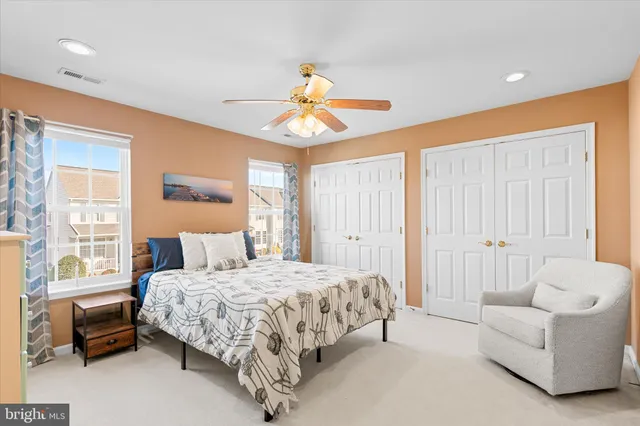 a view of a patio with table and chairs potted plants