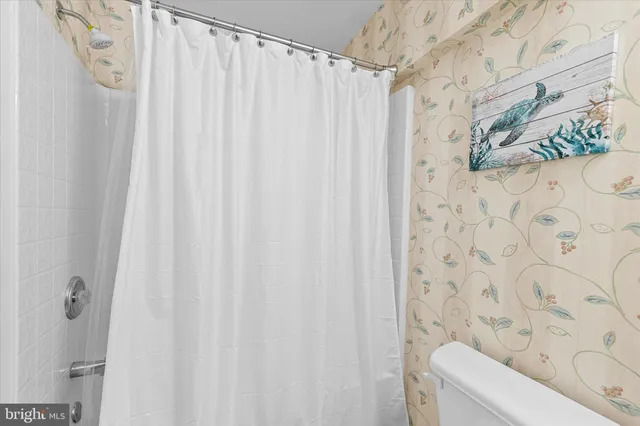 a picture of a bench in front of a window