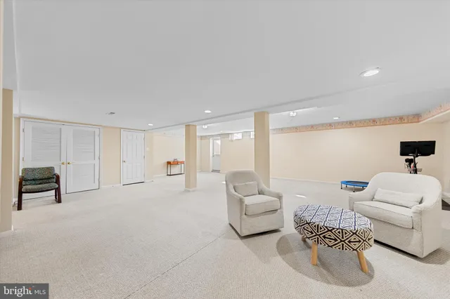 a view of a swimming pool with a dining table and chairs