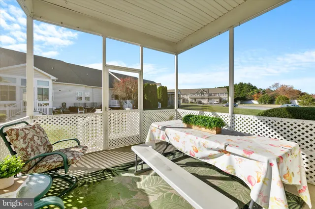 a sign board with buildings in the background