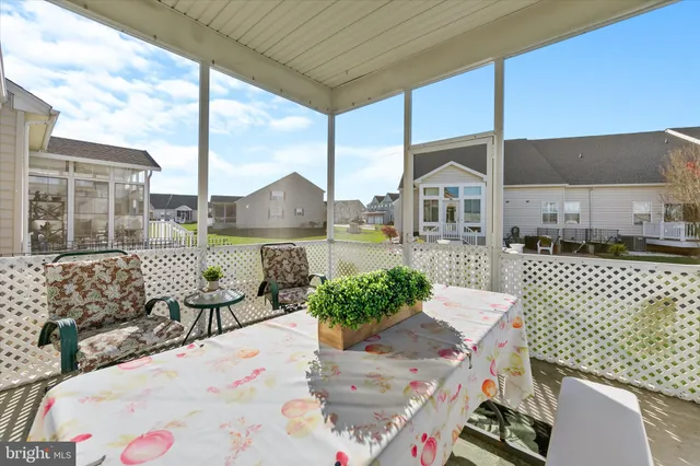 a front view of a building with trees