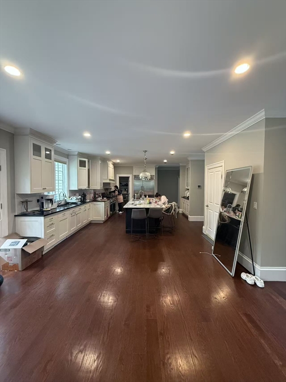 15 Cedar Road Brookline, MA 02467 - Photo 3 of 26 a living room with lots of furniture and gym equipment