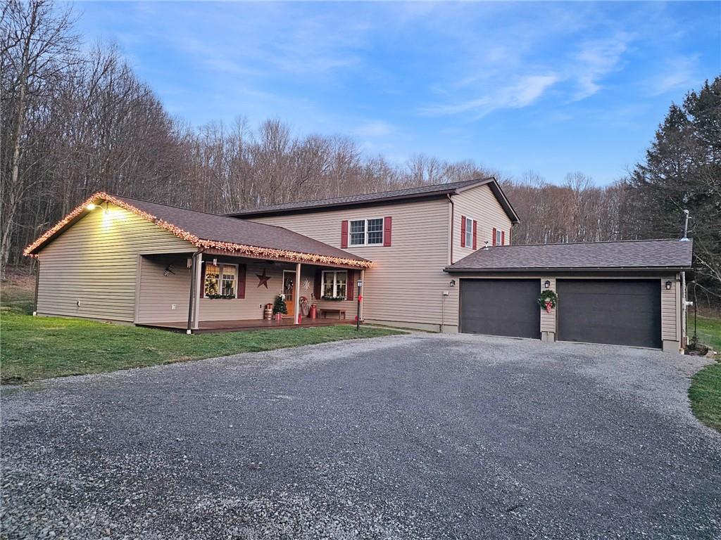 174 Rose Lane Rimersburg, PA 16248 - Photo 34 of 34 a front view of a house with a yard and garage