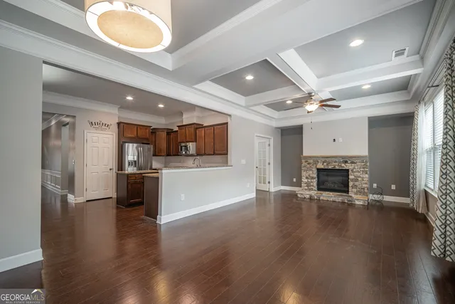 a view of kitchen with furniture and wooden floor