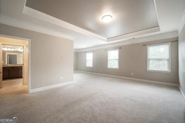 a view of empty room with windows