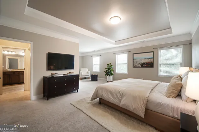 a bedroom with a bed and a flat screen television