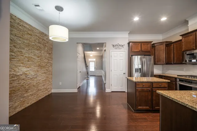a view of a kitchen cabinets and wooden floor