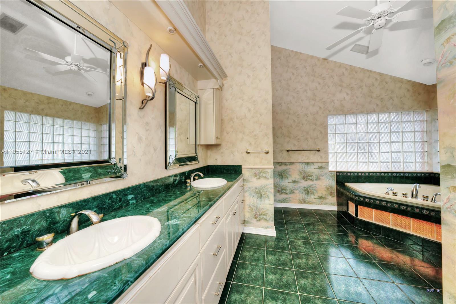 540 Southwest Salerno Road Stuart, FL 34997 - Photo 13 of 44 a bathroom with a granite countertop sink and a mirror