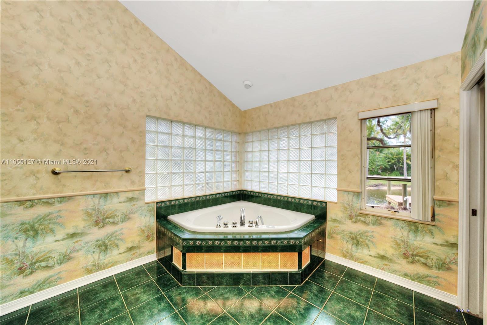 540 Southwest Salerno Road Stuart, FL 34997 - Photo 14 of 44 a view of a bathtub in a room