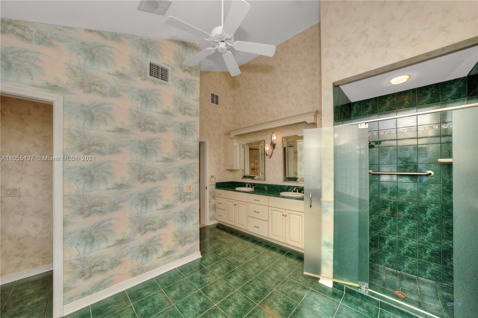 540 Southwest Salerno Road Stuart, FL 34997 - Photo 15 of 44 a bathroom with a granite countertop sink a mirror and shower