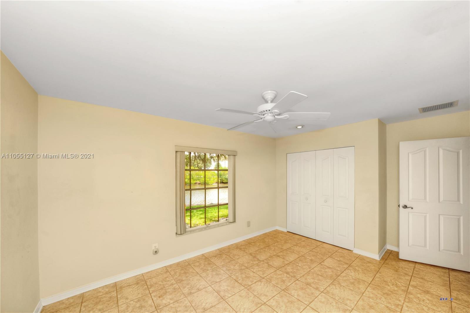 540 Southwest Salerno Road Stuart, FL 34997 - Photo 16 of 44 a view of an empty room with a window