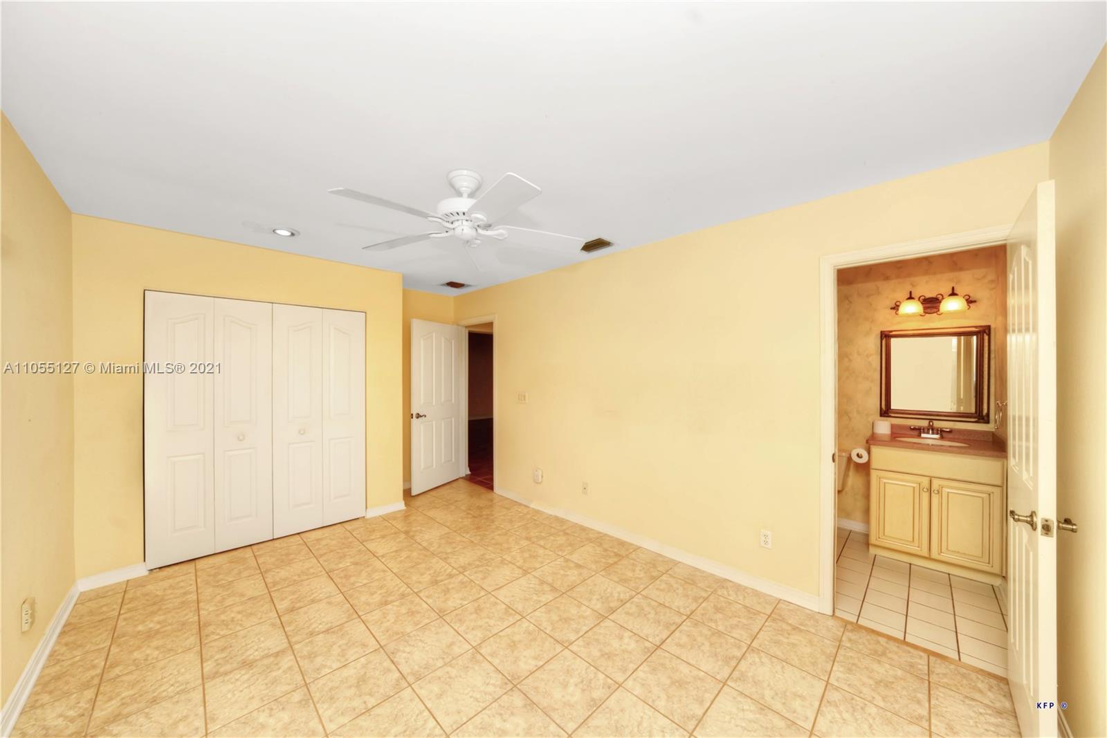 540 Southwest Salerno Road Stuart, FL 34997 - Photo 17 of 44 a view of a livingroom with wooden floor and a bathroom