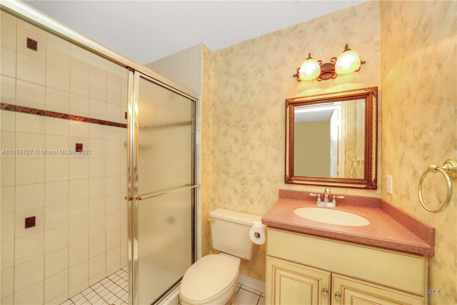 540 Southwest Salerno Road Stuart, FL 34997 - Photo 18 of 44 a bathroom with a sink a toilet and shower