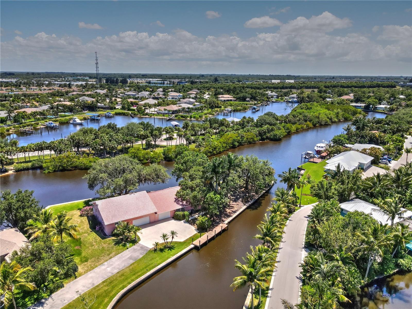 540 Southwest Salerno Road Stuart, FL 34997 - Photo 2 of 44 an aerial view of a house with a lake view