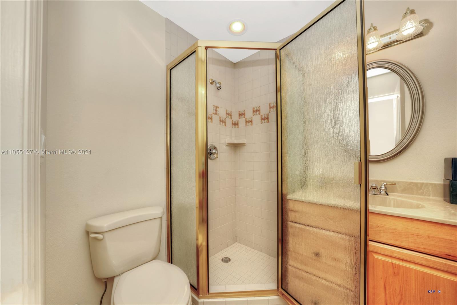 540 Southwest Salerno Road Stuart, FL 34997 - Photo 25 of 44 a bathroom with a shower a toilet and a sink