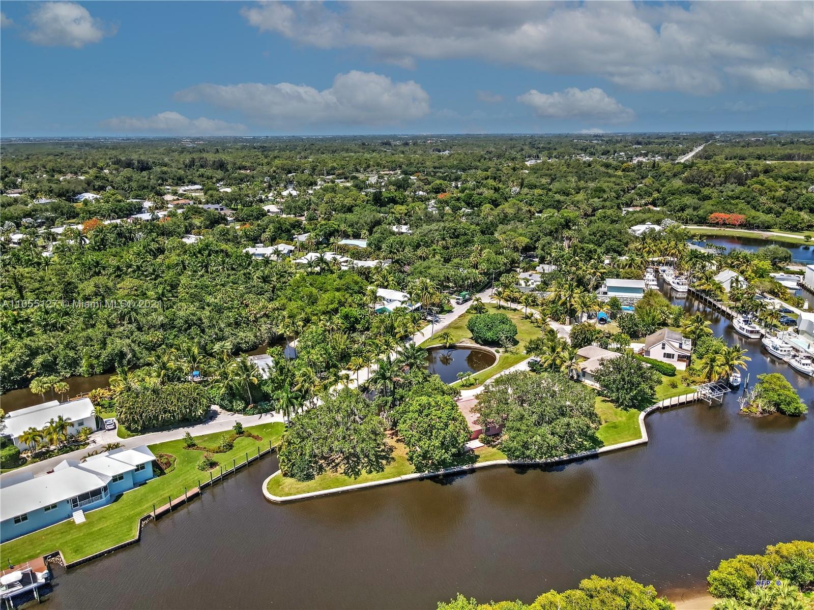 540 Southwest Salerno Road Stuart, FL 34997 - Photo 3 of 44 an aerial view of a houses with a lake view