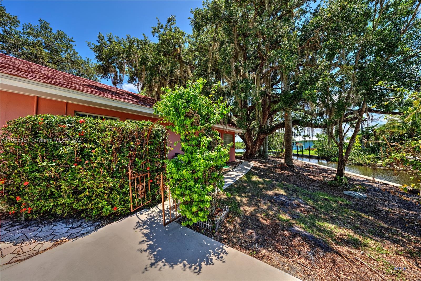 540 Southwest Salerno Road Stuart, FL 34997 - Photo 32 of 44 a backyard of a house with lots of green space